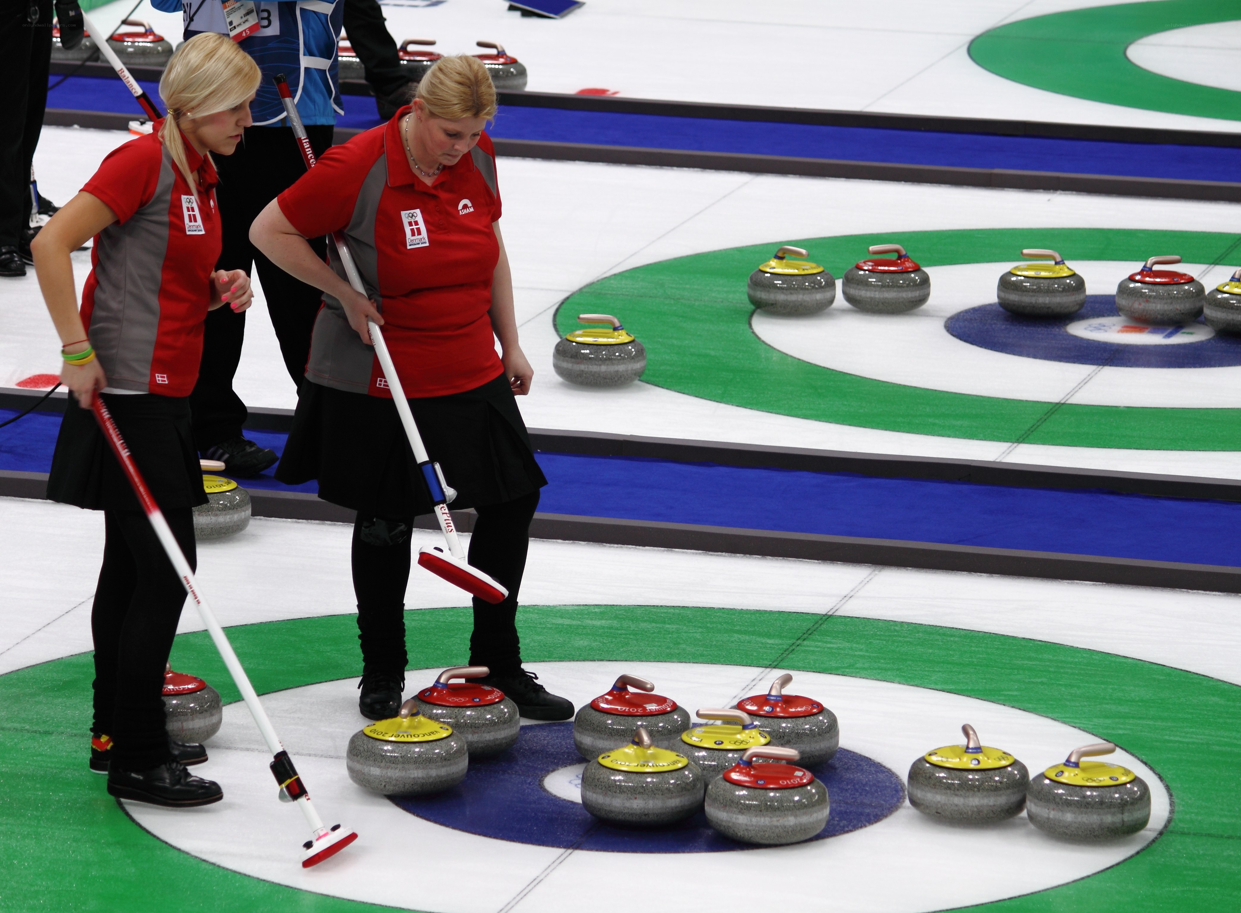 Curling players on the ice