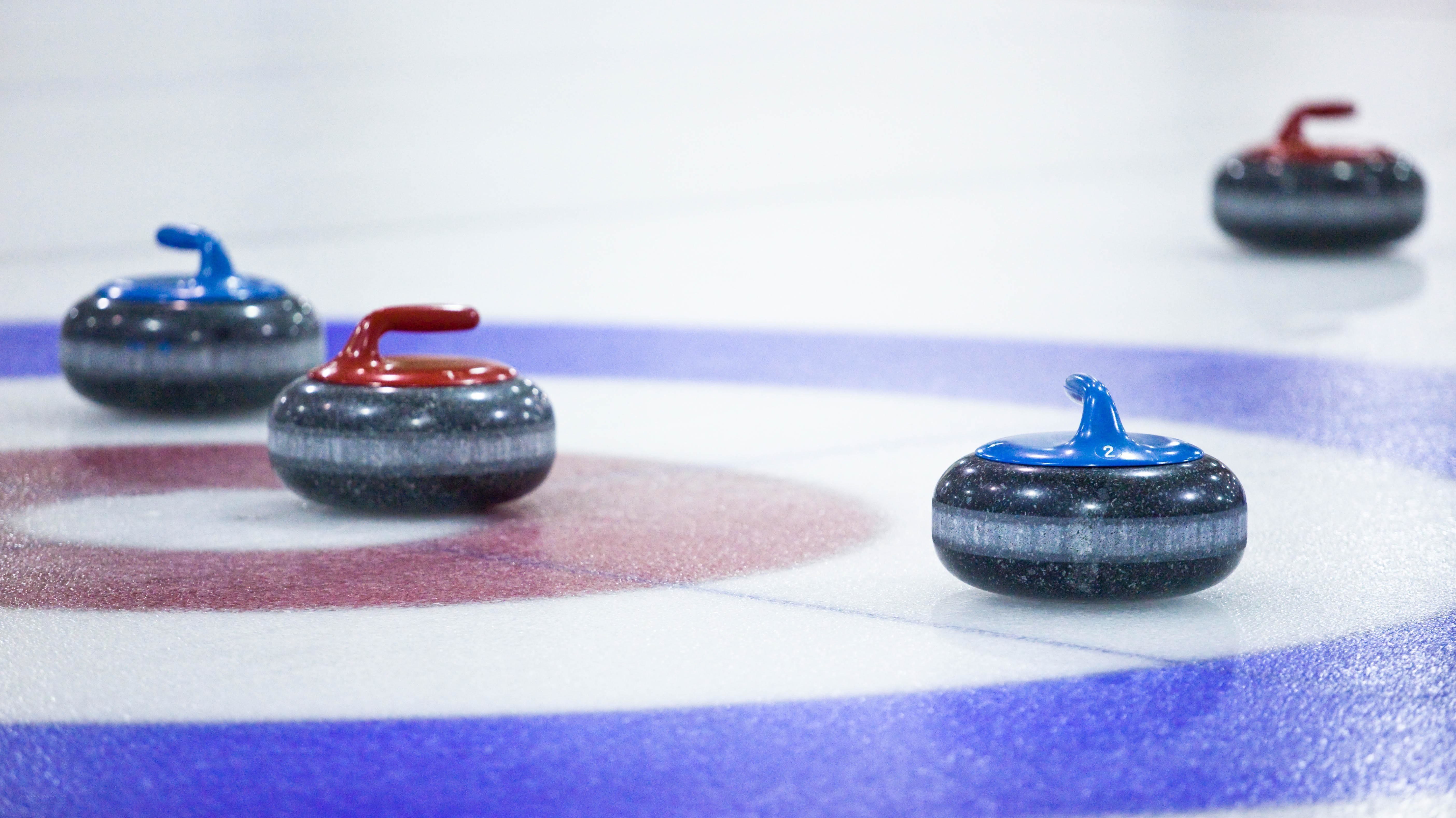 Curling stones on ice