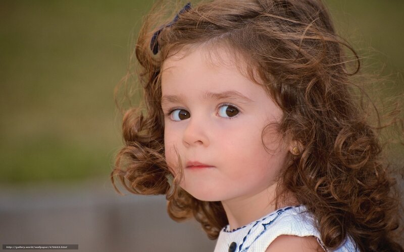 curly-haired girl looking away