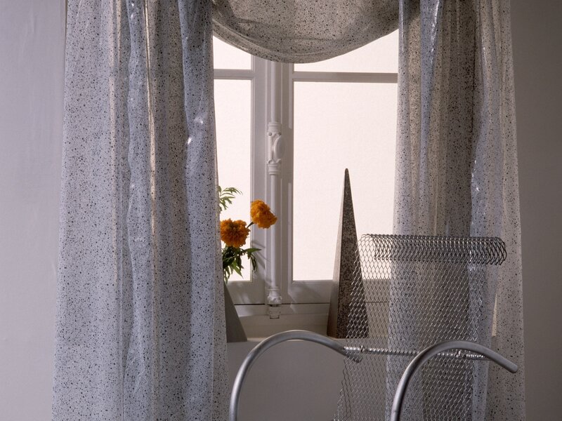 curtains and flowers by window