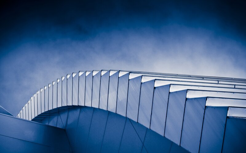 Curved Architectural Structure — Blue, Dramatic, Photograph, Sky, Clouds