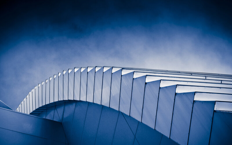 Curved Architectural Structure — Blue, Dramatic, Photograph