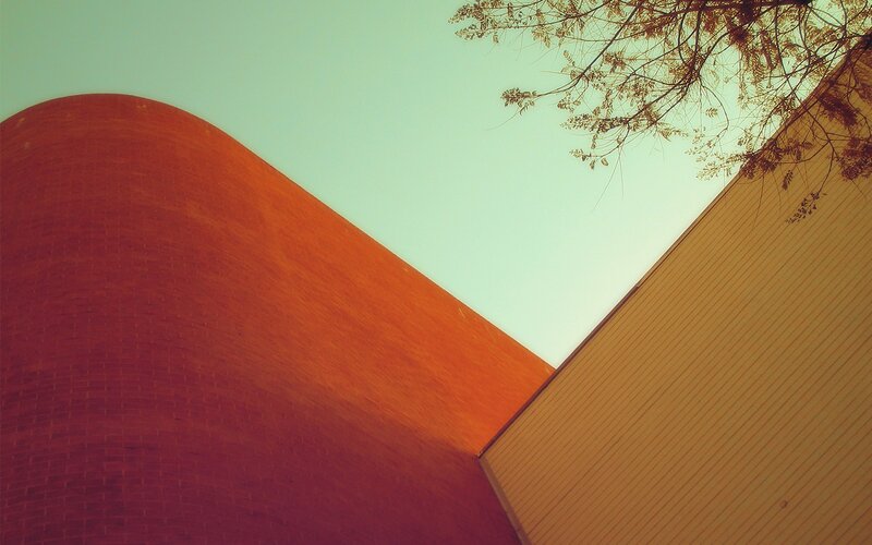 Curved Brick Building — Red