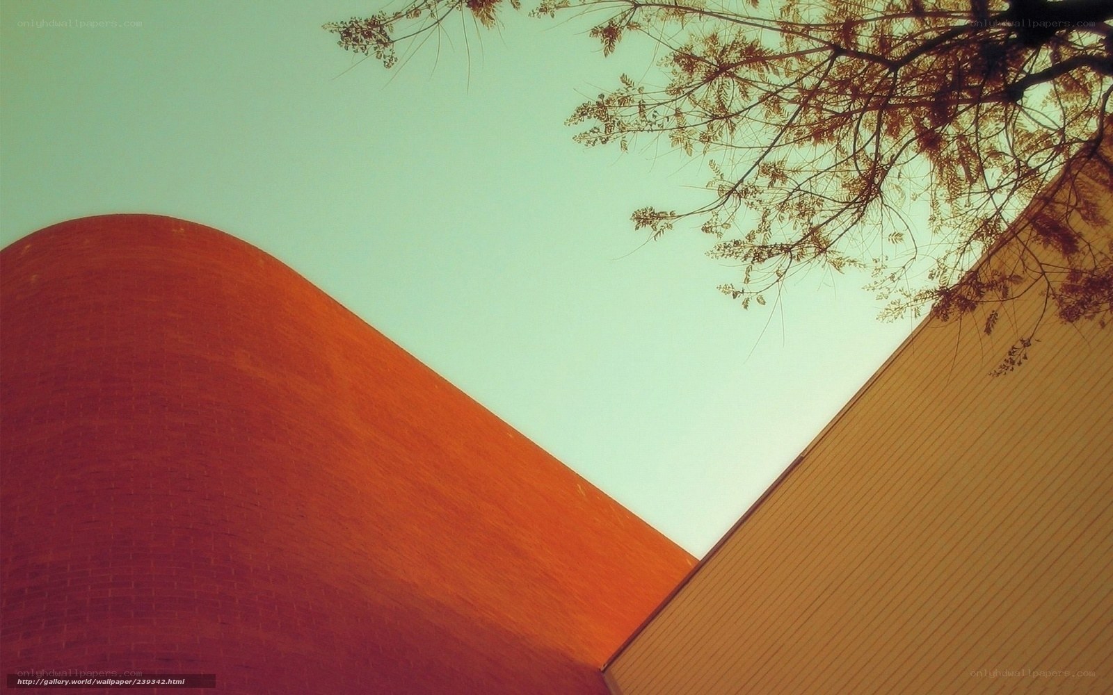 curved brick building under sky