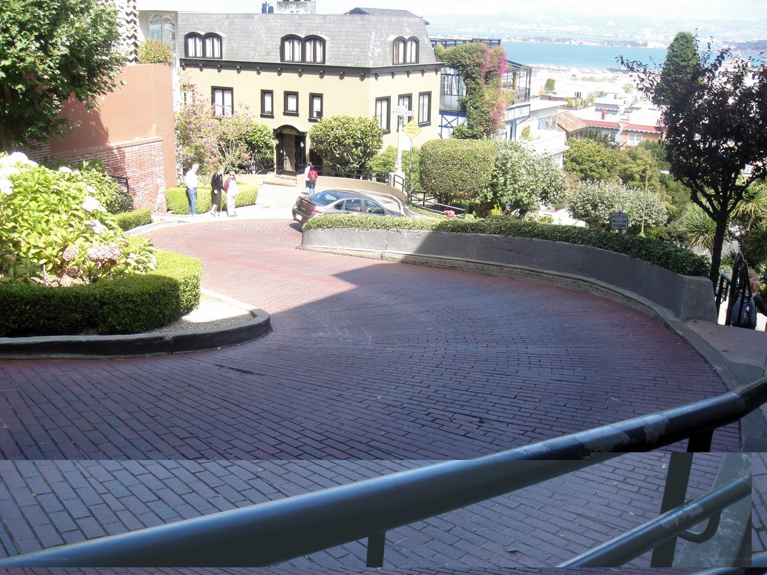 Curved brick street with bay view
