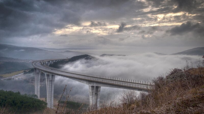 Curved Bridge over Fog — Gray