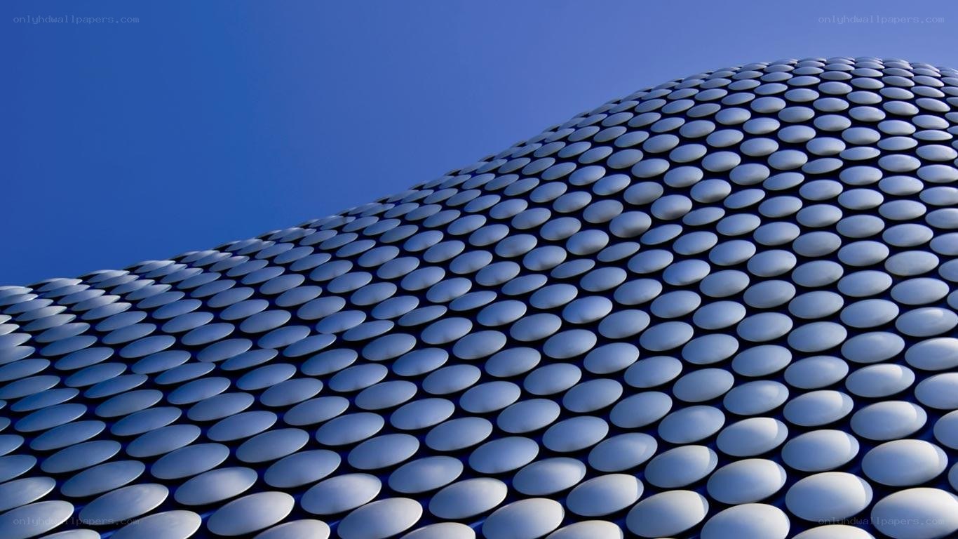curved building with circular panels