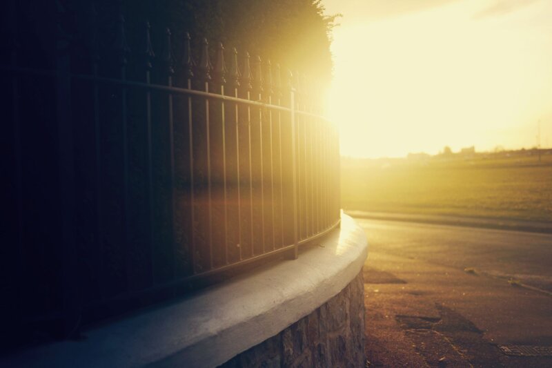 Curved Fence at Sunset