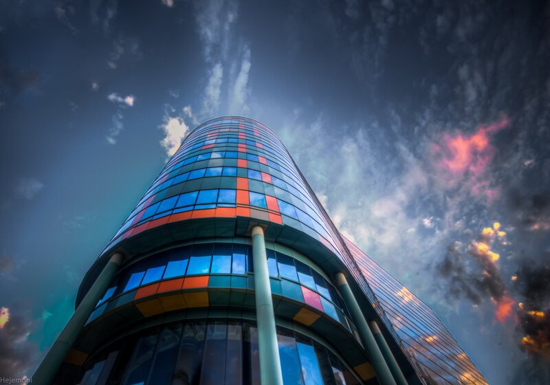 Curved Glass Skyscraper — Blue, Dramatic, Sunset