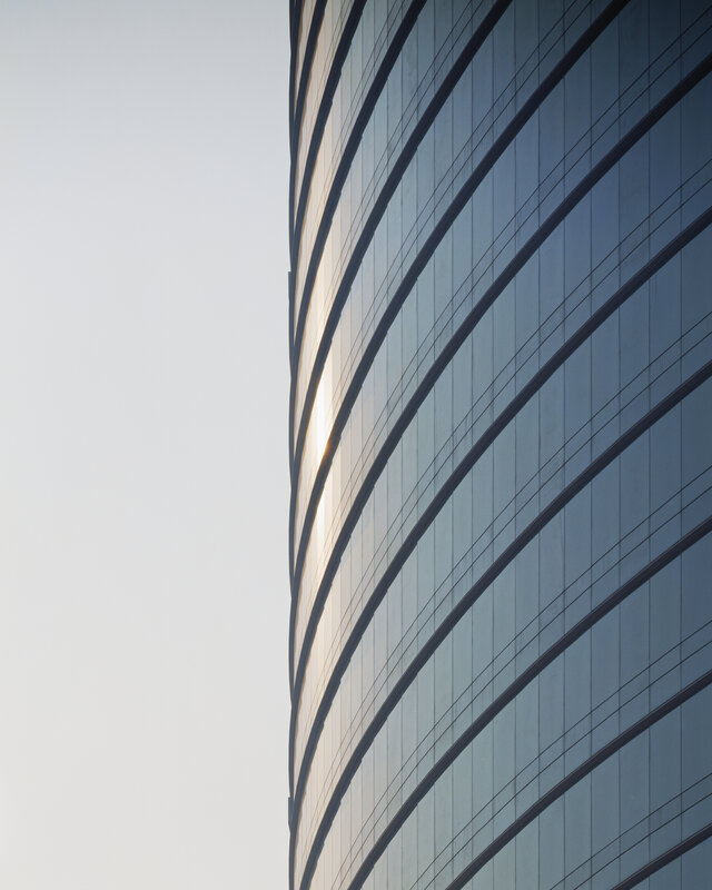curved glass skyscraper facade