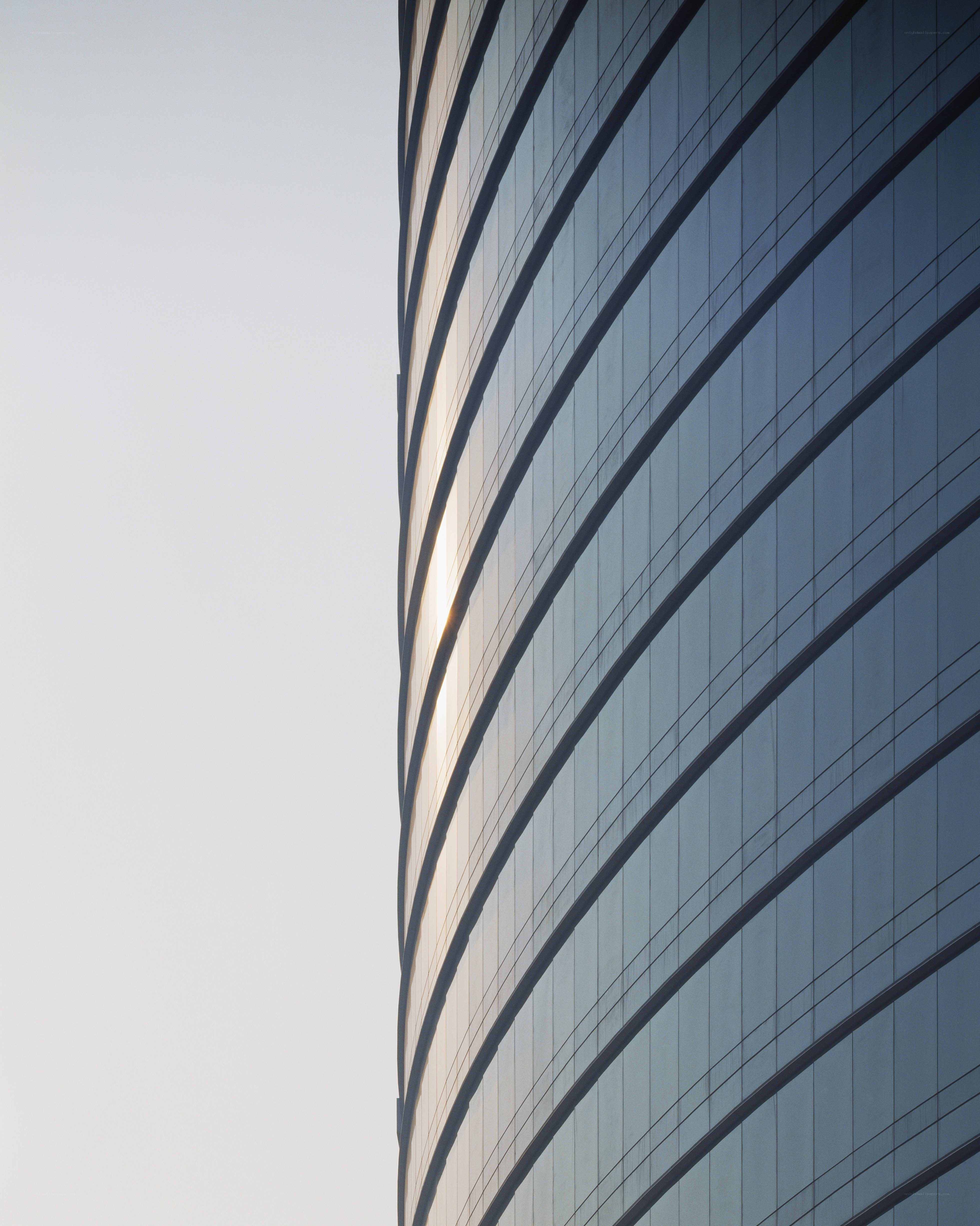 curved glass skyscraper facade