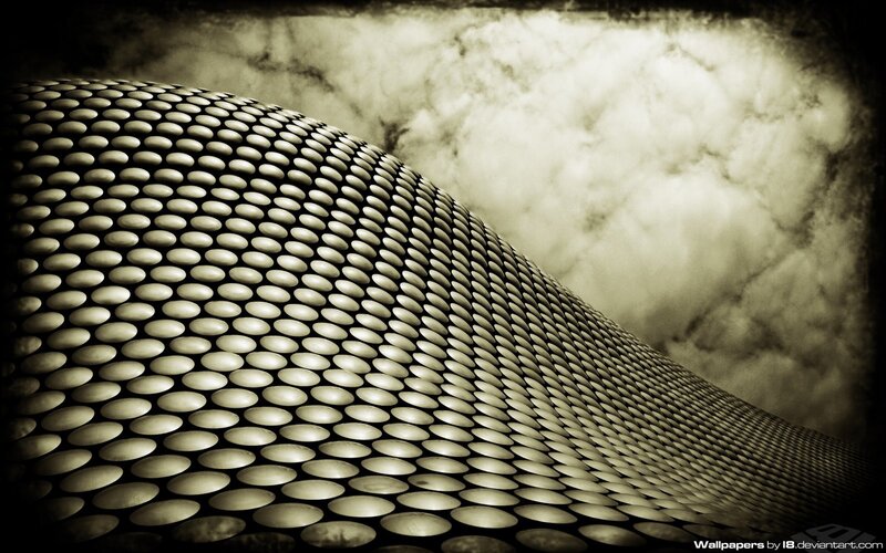 curved metallic surface with clouds