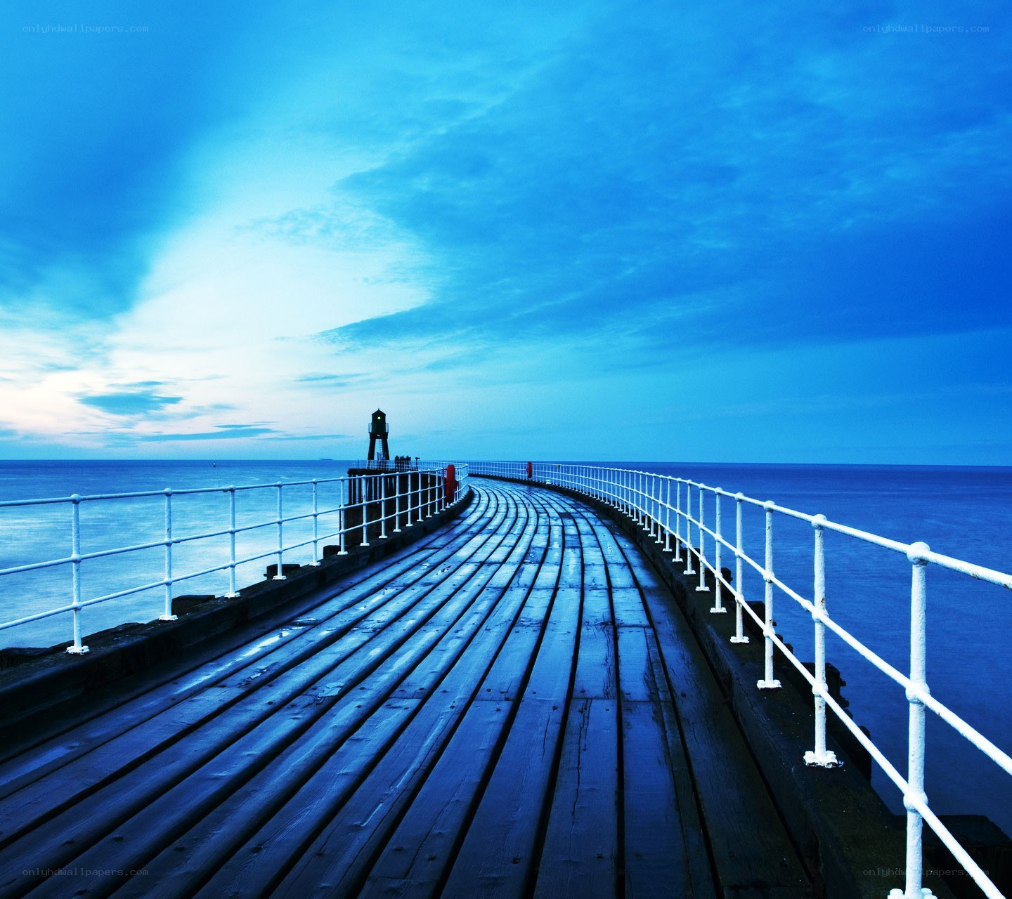Curved pier at dusk