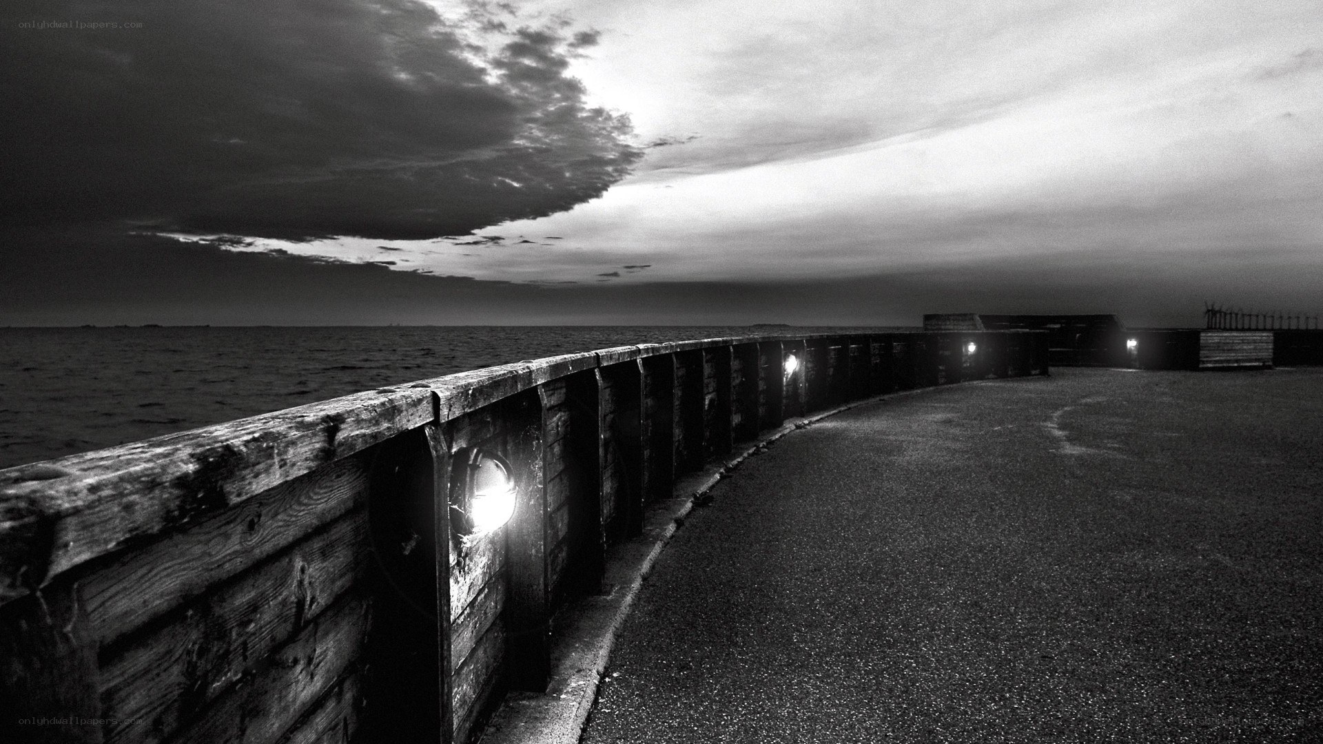 curved pier at dusk