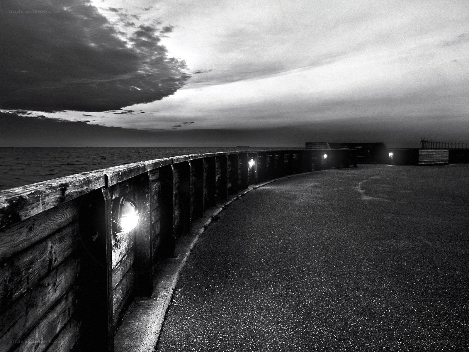 curved pier at dusk