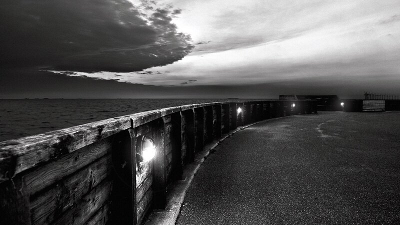 Curved Pier at Dusk — Black, Dramatic