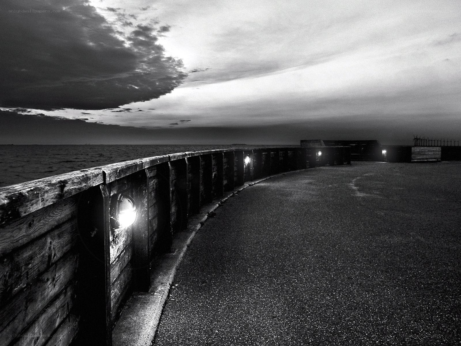 curved pier at dusk