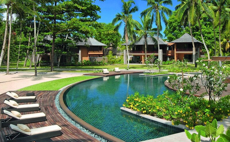 Curved Pool with Lounge Chairs