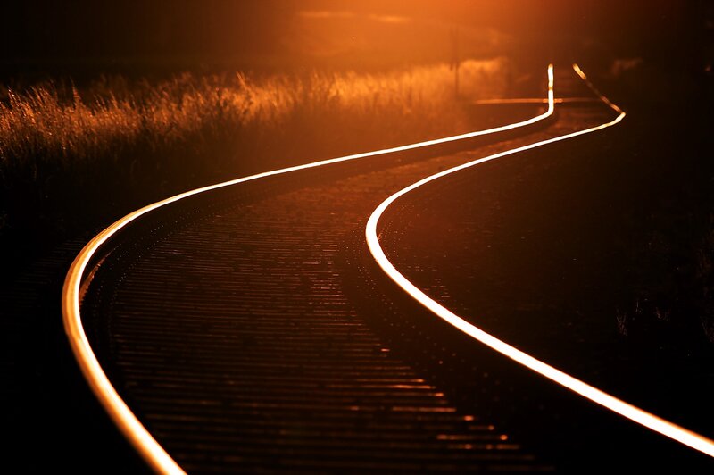 curved railway track at night