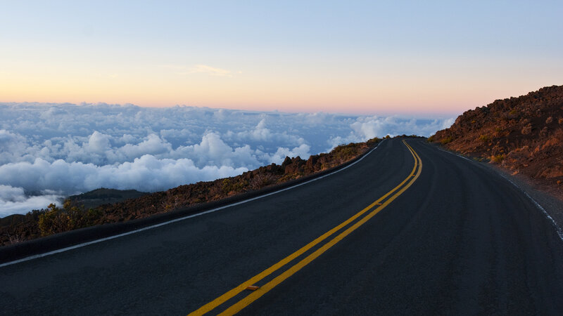 Curved Road Above Clouds