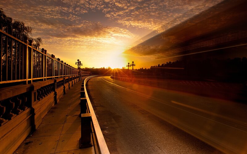 Curved Road at Sunset — Orange, Dramatic, Photograph, Fence
