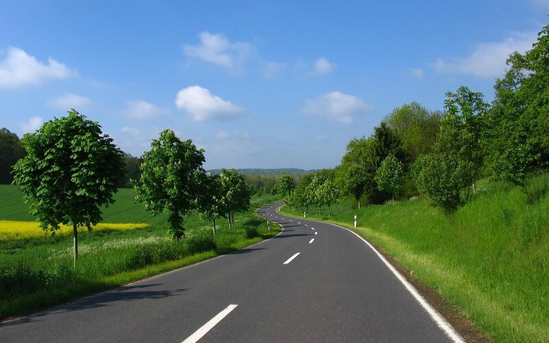 Curved Road in Countryside — Green, Serene, Afternoon, Photograph