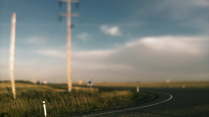 Curved Road in Field