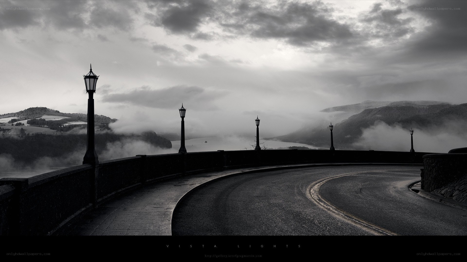 Curved Road Over a Misty Valley