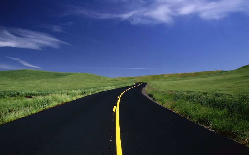Curved Road Through Fields