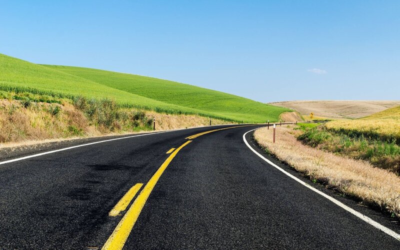 Curved Road Through Hills — Black
