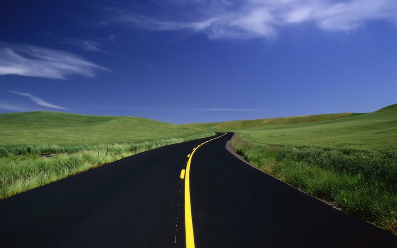 Curved Road Through Hills — Green