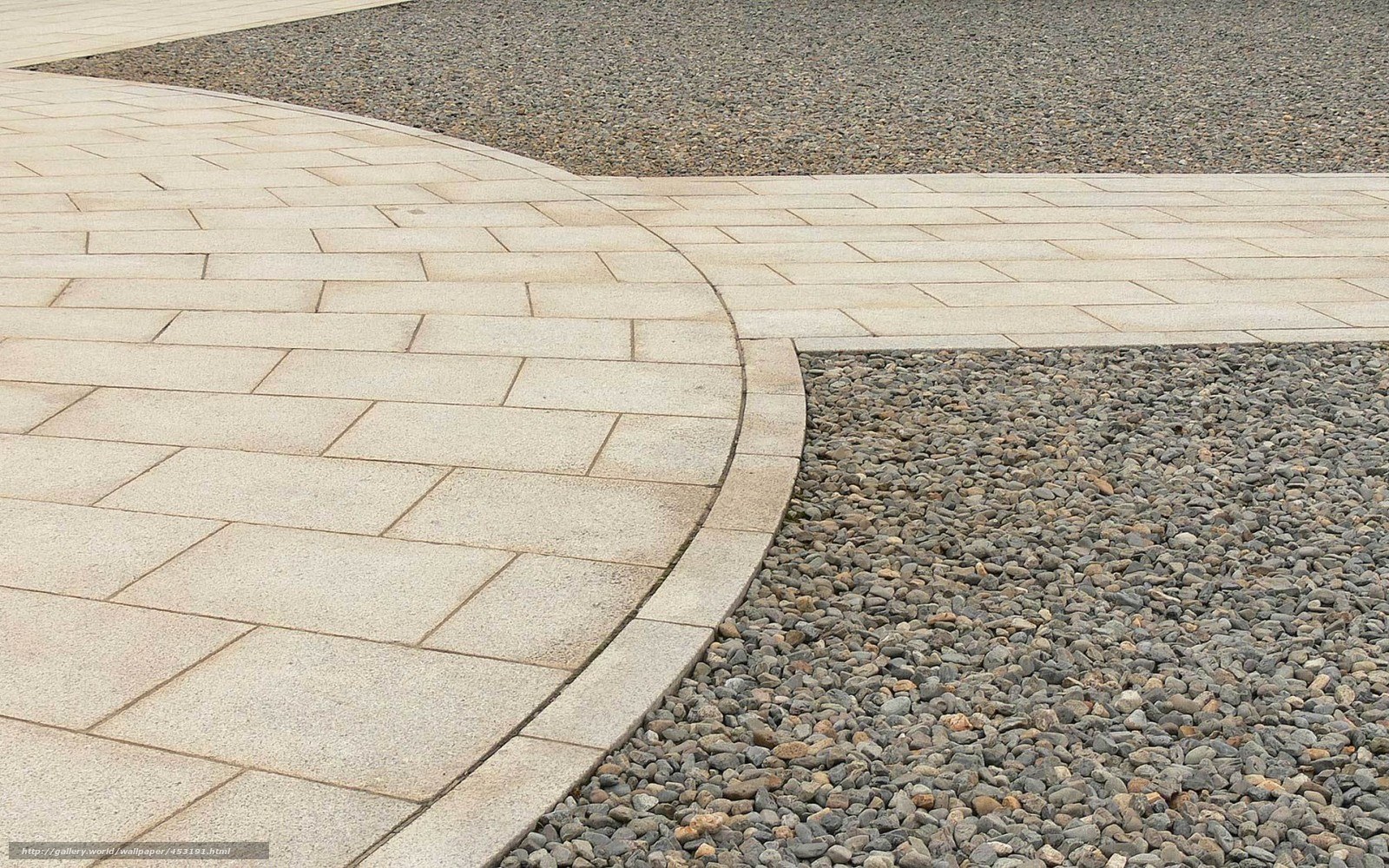 Curved stone path with gravel