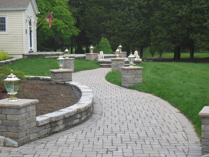 curved stone pathway with lanterns