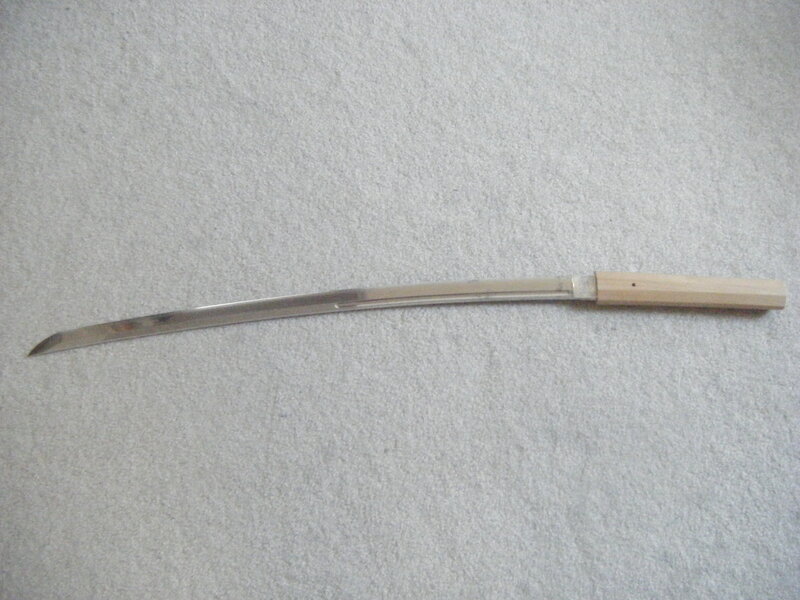 curved sword on carpet