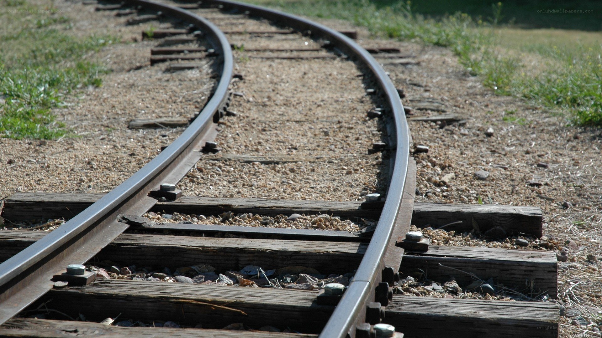curved train track in sunlight