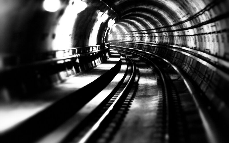 Curved Train Tracks in Tunnel — Black