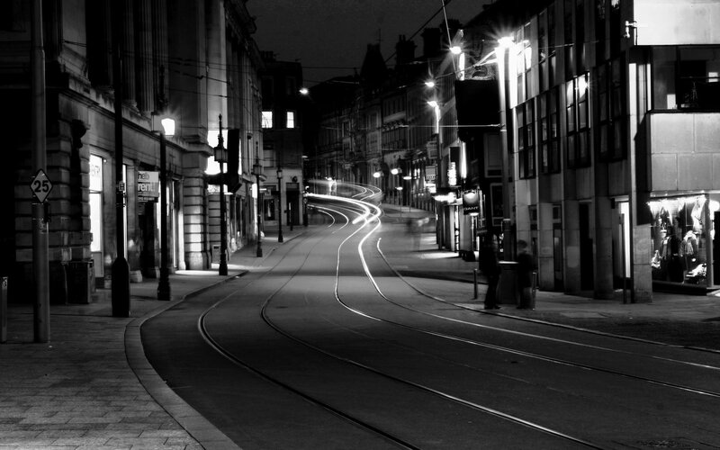 Curved Tram Tracks at Night