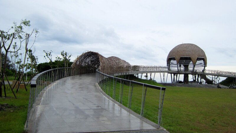 Curved Walkway with Thatched Structures