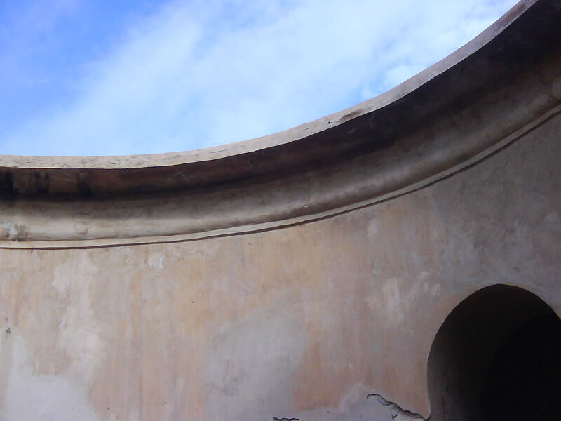 curved wall under blue sky