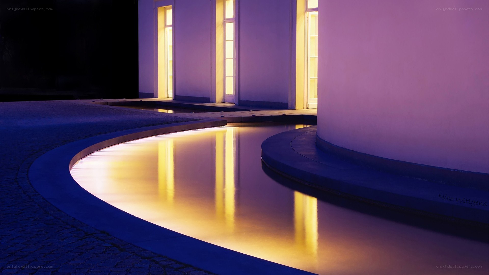 curved water feature at night