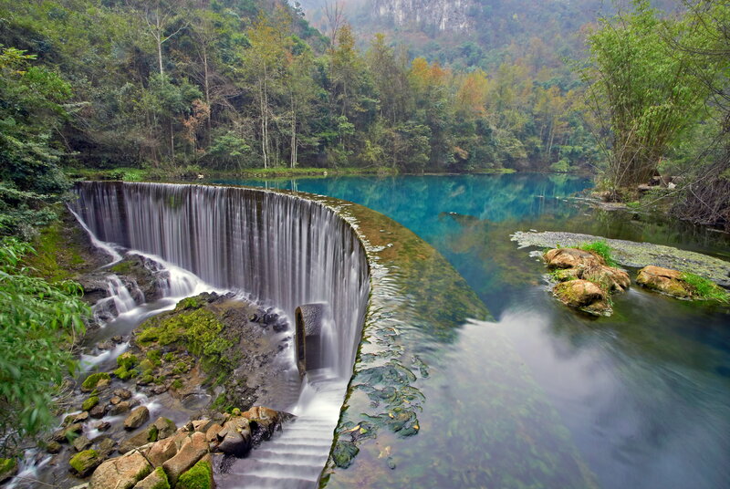 Curved Waterfall in Forest — Blue