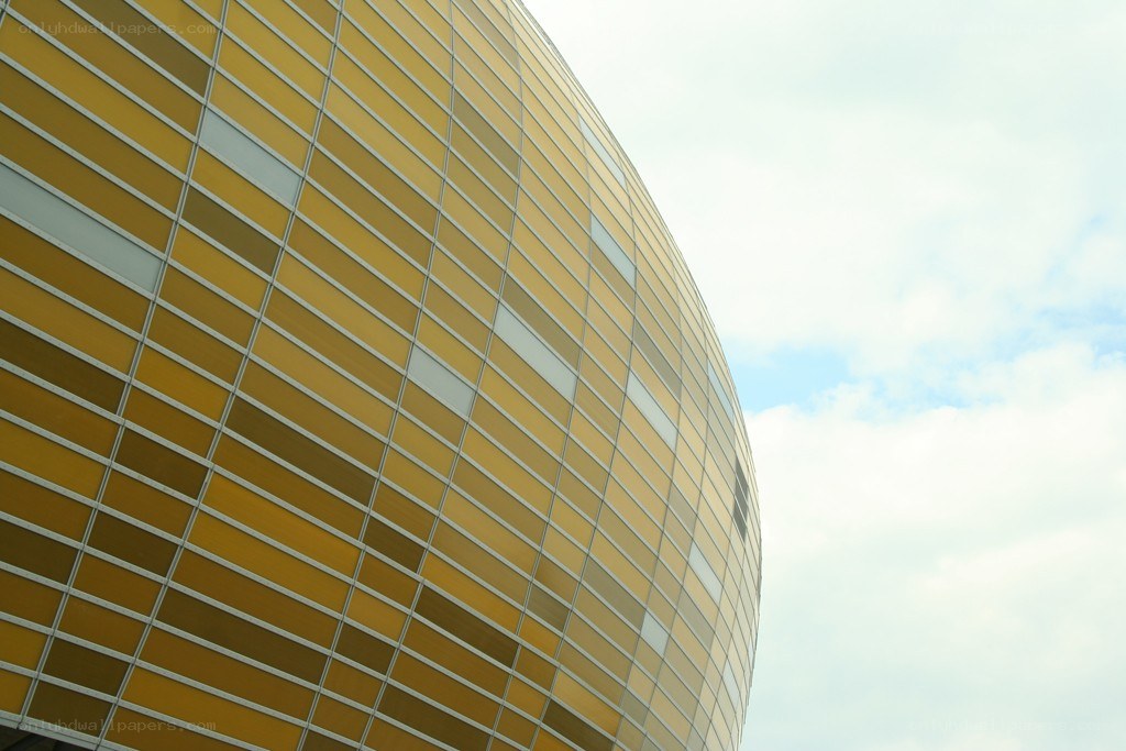 curved yellow building facade