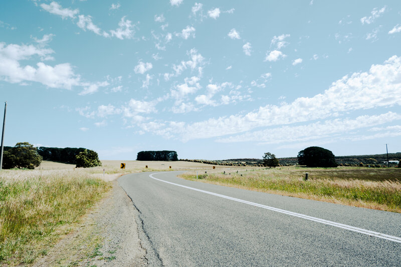 Curving Road in Countryside — Blue