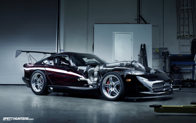 custom black sports car in garage