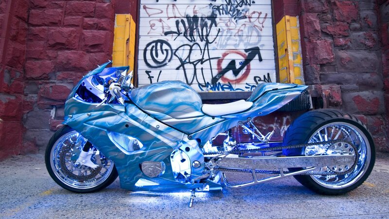 custom blue motorcycle in alley