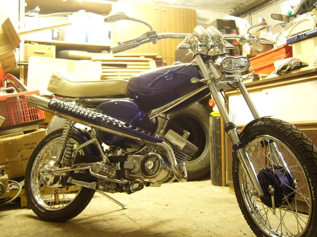 Custom blue motorcycle in garage