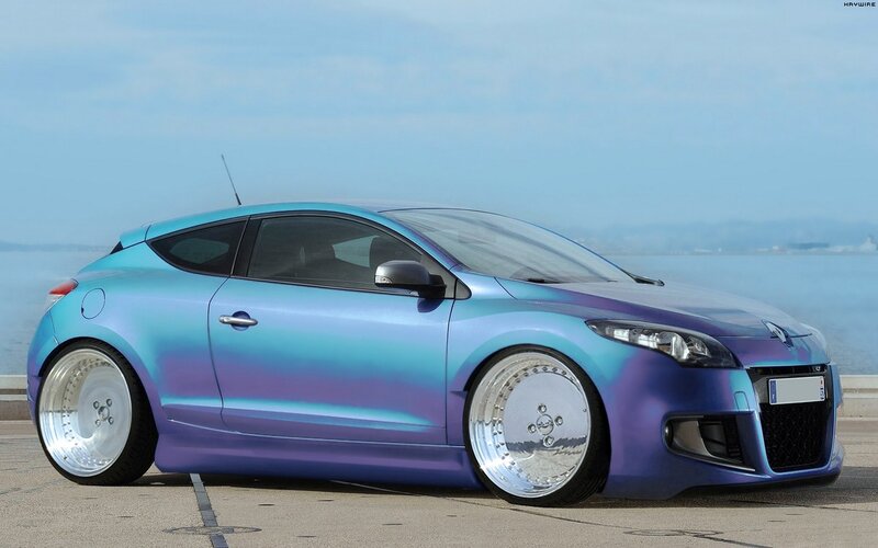 custom blue-purple car by the sea