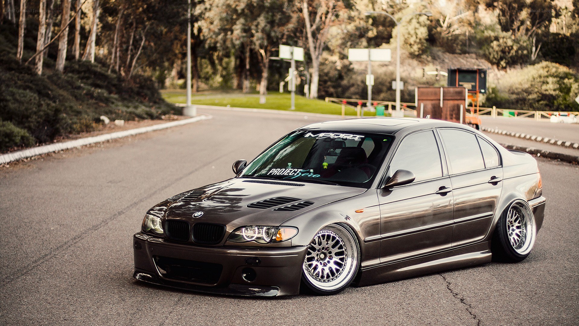 Custom BMW sedan on a road