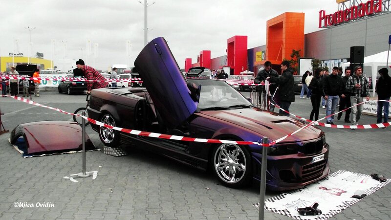 Custom car with gullwing doors on display