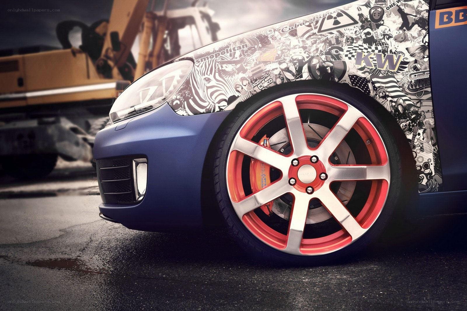 custom car with red wheels